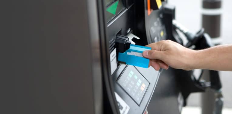 Hand inserting a card into a card reader