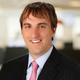 Headshot of a man with a blurred background