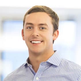 Headshot of a man with a blurred background