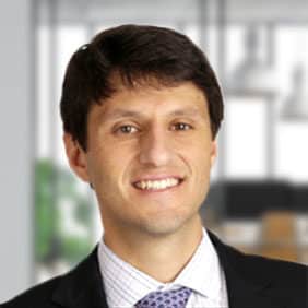 Headshot of a man with a blurred background