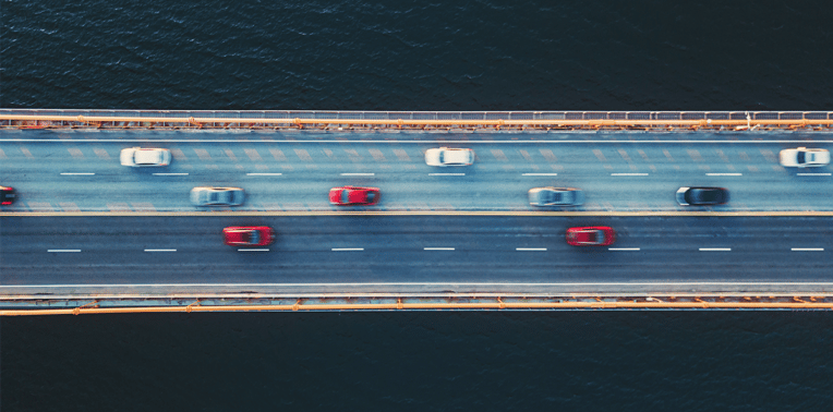 image of cars driving over bridge evoking mobile workforce
