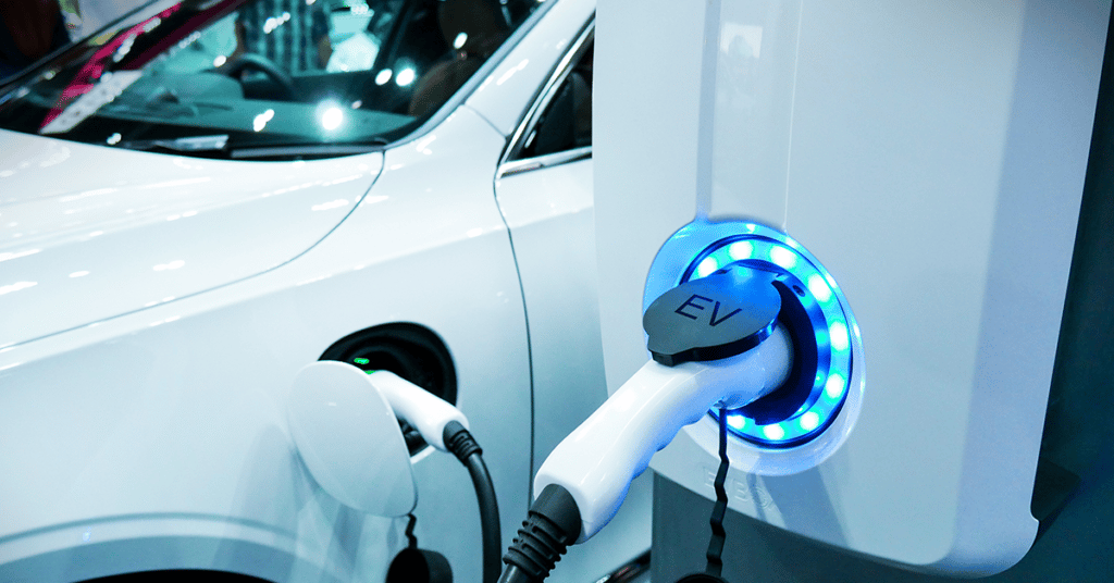 electric vehicle at charging station evoking EV incentives