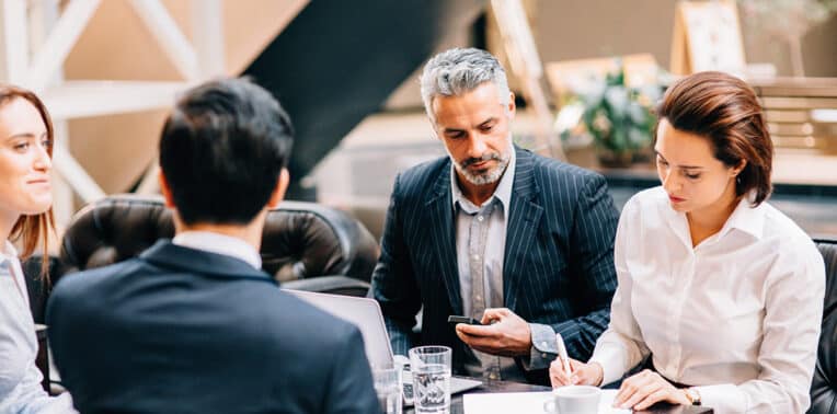 image of business people meeting, evoking customer-centric cfo