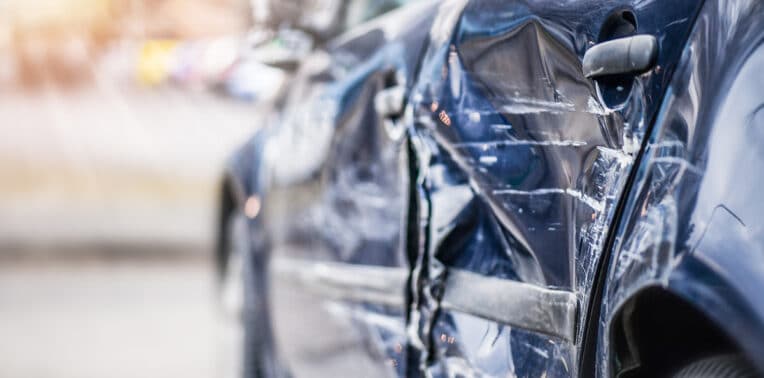 image of damaged vehicle evoking driver safety trends