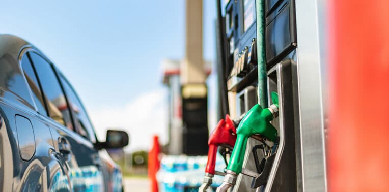 image of car parked at gas station pump