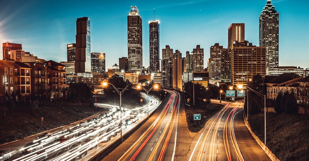 traffic in big city at night evoking transitioning vehicle programs