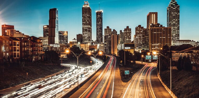 traffic in big city at night evoking transitioning vehicle programs
